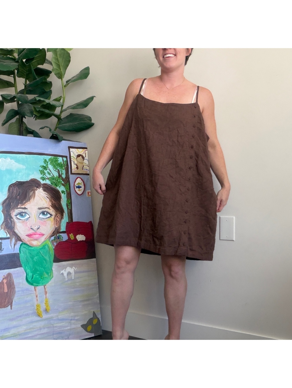 Brown sleeveless mini dress with buttons